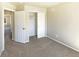 An inviting bedroom features soft carpet, neutral paint, and a closet for storage solutions at 441 Grey Swallow St, Brighton, CO 80601