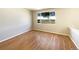 Bright bedroom featuring hardwood floors and a large window offering natural light at 441 Grey Swallow St, Brighton, CO 80601