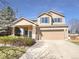 Charming two-story home with a two-car garage and well-maintained landscaping at 441 Grey Swallow St, Brighton, CO 80601