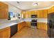Functional kitchen with stainless steel appliances, ample counter space, and plenty of cabinets at 441 Grey Swallow St, Brighton, CO 80601