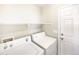 Functional laundry room equipped with a washer, dryer, and overhead shelving at 441 Grey Swallow St, Brighton, CO 80601