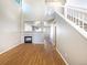 Spacious living room with hardwood floors, fireplace, and staircase to the second floor at 441 Grey Swallow St, Brighton, CO 80601