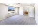 A bright bedroom with a large window and neutral decor. Ensuite bathroom is visible at 441 Grey Swallow St, Brighton, CO 80601