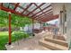 Back patio featuring a hot tub, seating, and a covered pergola at 1346 S Grant St, Longmont, CO 80501