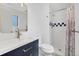 Stylish bathroom with modern vanity, tiled shower, and decorative accents at 1346 S Grant St, Longmont, CO 80501