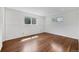 Bright bedroom featuring hardwood floors, recessed lighting, and two windows at 1346 S Grant St, Longmont, CO 80501