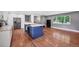 Bright kitchen with white cabinetry, stainless steel appliances, and a blue kitchen island at 1346 S Grant St, Longmont, CO 80501