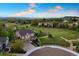 Beautiful aerial shot of the home and neighborhood with mountain views at 4704 Cedar Glen Pl, Castle Rock, CO 80109