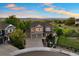 Aerial view of a home with a large yard, three-car garage, and mountain views at 4704 Cedar Glen Pl, Castle Rock, CO 80109