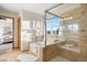 Bright bathroom featuring a soaking tub and a glass shower with a seat at 4704 Cedar Glen Pl, Castle Rock, CO 80109