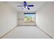 Minimalist bedroom with neutral carpet, window, and a simple shelf at 4704 Cedar Glen Pl, Castle Rock, CO 80109
