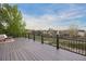 Spacious deck with black railings and beautiful neighborhood view at 4704 Cedar Glen Pl, Castle Rock, CO 80109