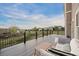 Large outdoor deck with scenic views of the surrounding landscape and comfortable seating at 4704 Cedar Glen Pl, Castle Rock, CO 80109