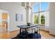 Dining area with tall ceilings, large windows, and hardwood floors at 4704 Cedar Glen Pl, Castle Rock, CO 80109