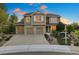 Beautiful two-story home with a three-car garage and well-manicured landscaping at 4704 Cedar Glen Pl, Castle Rock, CO 80109