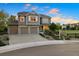 Charming front exterior with a three-car garage and a lush landscaped yard at 4704 Cedar Glen Pl, Castle Rock, CO 80109