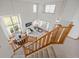 Open-concept living space with hardwood stairs, a view of the dining and living areas at 4704 Cedar Glen Pl, Castle Rock, CO 80109