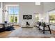 Bright living room featuring tall ceilings and large windows for natural light at 4704 Cedar Glen Pl, Castle Rock, CO 80109