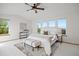Bright and airy main bedroom featuring multiple windows and stylish decor at 4704 Cedar Glen Pl, Castle Rock, CO 80109