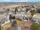 Aerial view of a home surrounded by mature trees, lush landscaping, and neighborhood views at 19113 E Fair Dr, Aurora, CO 80016