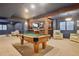 Entertainment basement with a pool table and a bar with wooden features for storage and seating at 19113 E Fair Dr, Aurora, CO 80016