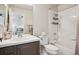 Bathroom with combined shower and tub with gray vanity at 19113 E Fair Dr, Aurora, CO 80016