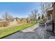 Grassy backyard, stamped concrete patio, and dining table at 9290 N Raleigh St, Westminster, CO 80031