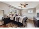 Bedroom with hardwood floors, ceiling fan and large windows for natural light and stylish rug at 9290 N Raleigh St, Westminster, CO 80031