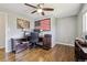 Bedroom with a wood ceiling fan, American flag art, and a dark wood desk with computer at 9290 N Raleigh St, Westminster, CO 80031