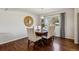 Elegant dining room featuring hardwood floors, a wooden table with seating for six, and a stylish light fixture at 9290 N Raleigh St, Westminster, CO 80031