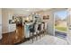 Open kitchen layout with island seating, white cabinets and easy access to backyard at 9290 N Raleigh St, Westminster, CO 80031