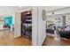 Convenient laundry area with modern washer and dryer, shelving for storage, and easy access to the living area at 9290 N Raleigh St, Westminster, CO 80031