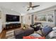 Inviting living room with hardwood floors, ceiling fan, a comfortable sofa and large windows at 9290 N Raleigh St, Westminster, CO 80031
