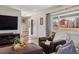 Comfortable living room with hardwood floors, TV, and a view of the front entry at 9290 N Raleigh St, Westminster, CO 80031