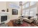 Bright living room with fireplace and high ceilings at 13953 E Princeton Pl # B, Aurora, CO 80014