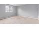 Spacious bedroom with a window providing natural light and carpeted floor at 9328 Fenton Ct, Westminster, CO 80031