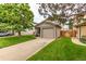 Charming exterior featuring a well-maintained lawn and an attached one car garage at 9328 Fenton Ct, Westminster, CO 80031