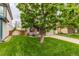 Beautiful home with a lush green lawn and mature tree at 9328 Fenton Ct, Westminster, CO 80031
