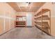 Unfinished garage features concrete floor and workbench at 9328 Fenton Ct, Westminster, CO 80031