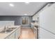 Bright kitchen featuring ample counter space and a view to the living area at 9328 Fenton Ct, Westminster, CO 80031
