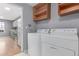 Laundry room with washer, dryer, and overhead shelving at 9328 Fenton Ct, Westminster, CO 80031