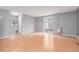 Open-concept living room featuring neutral tones and access to backyard patio at 9328 Fenton Ct, Westminster, CO 80031