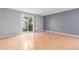 Spacious living room with sliding glass doors to patio and light hardwood floors at 9328 Fenton Ct, Westminster, CO 80031