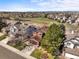 Aerial view of a residential neighborhood, showcasing the lush greenery and mountain views at 9145 Sugarstone Cir, Highlands Ranch, CO 80130