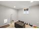 A well-lit basement exercise area with fitness equipment and a window for natural light at 9145 Sugarstone Cir, Highlands Ranch, CO 80130