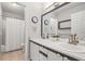 Traditional bathroom features double sinks and a shower-tub combination at 9145 Sugarstone Cir, Highlands Ranch, CO 80130