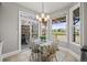 Charming dining nook with a table, large windows, and access to a deck at 9145 Sugarstone Cir, Highlands Ranch, CO 80130