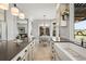 Beautiful kitchen featuring a farmhouse sink, natural light, and an adjacent dining area at 9145 Sugarstone Cir, Highlands Ranch, CO 80130