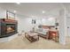 Cozy living room with a fireplace and comfortable seating, perfect for relaxing at 9145 Sugarstone Cir, Highlands Ranch, CO 80130
