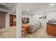 Basement living room featuring a wet bar, fireplace, and stylish decor at 9145 Sugarstone Cir, Highlands Ranch, CO 80130